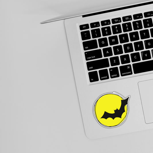 Yellow bat sticker on silver laptop, trendy vinyl sticker from Sticksnap
