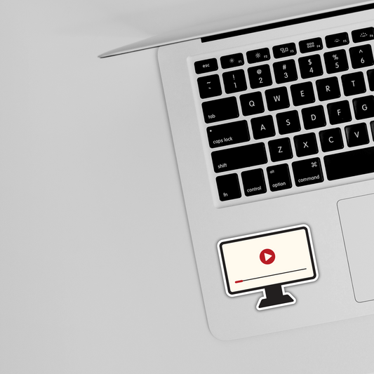 Cute video player sticker on silver laptop keyboard, trendy sticker design from Sticksnap