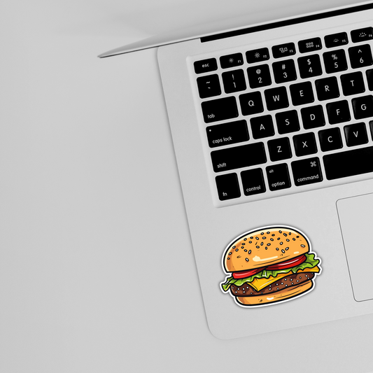 Cute hamburger sticker on silver laptop near keyboard, trendy sticker design from Sticksnap