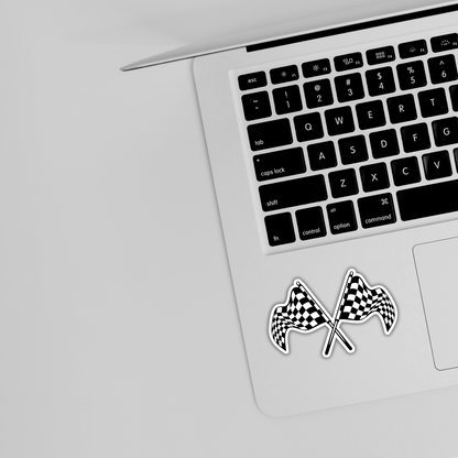 Crossed checkered flags sticker on laptop, trendy racing design from Sticksnap.